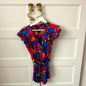 Love Moschino silk blouse size 6 with ruffles and a waist tie.